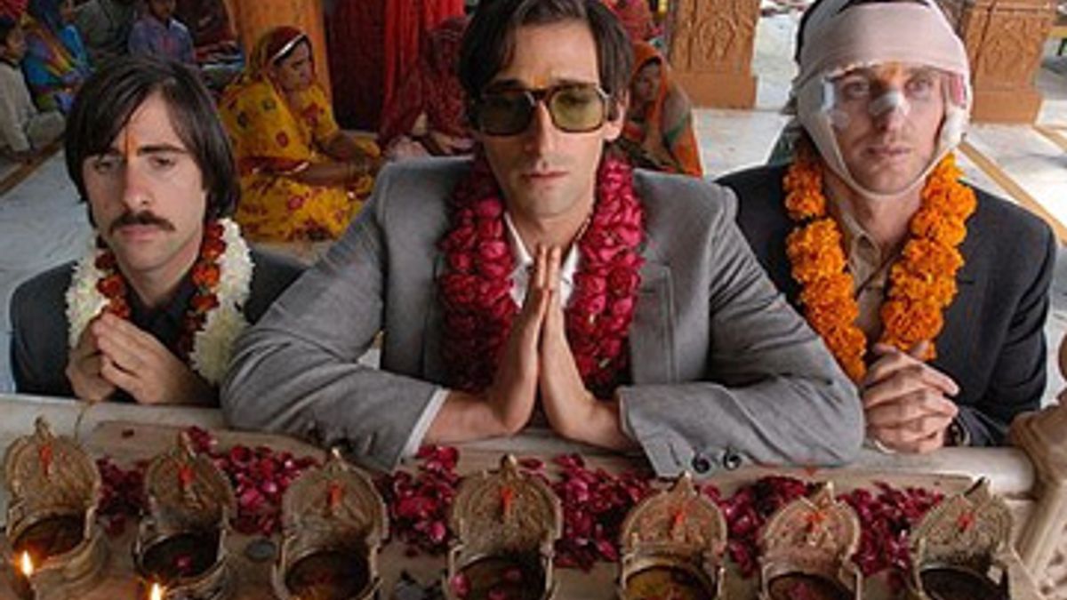 The gray suit of Adrien Brody in aboard the Darjeeling Limited