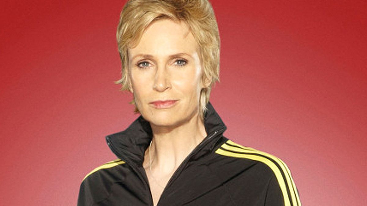 Glee Jane Lynch as Sue Sylvester pretending to bite Chris Colfer