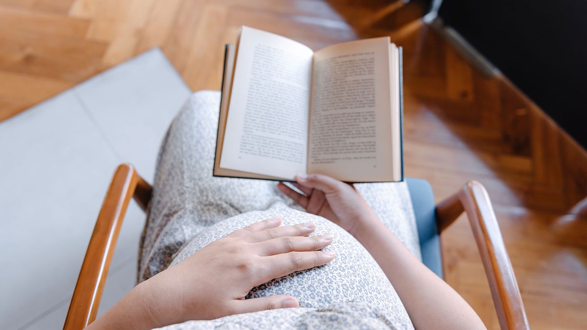 https://mediaproxy.salon.com/width/1200/height/675/https://media.salon.com/2022/07/pregnant-woman-reading-0715221.jpg