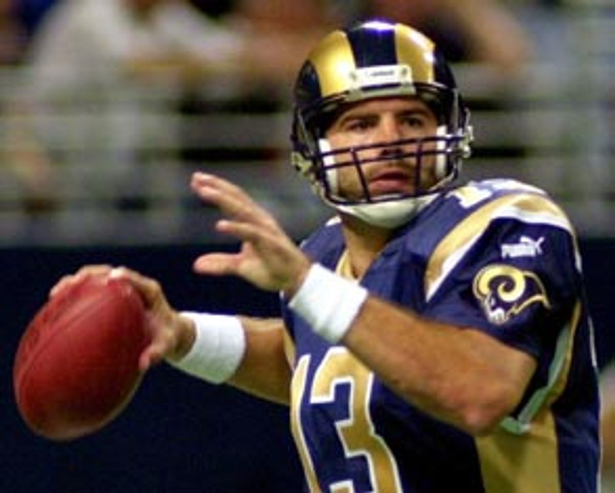 St. Louis Rams quarterback Kurt Warner (13) reaches back to pass