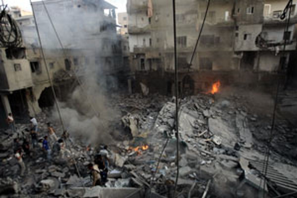 People search the rubble of a destroyed building, minutes after an Israeli warplane missiles attack in the center of the southern coastal city of Tyre, Lebanon, Wednesday July 26, 2006. Hezbollah inflicted heavy casualties on Israeli troops as they battled for a key hilltop town in southern Lebanon for a fourth day Wednesday, with as many as 14 soldiers reported killed and Lebanese officials confirmed that four U.N. observers were killed by an Israeli airstrike on their post Tuesday night. (AP Photo/Lefteris Pitarakis) (Lefteris Pitarakis)
