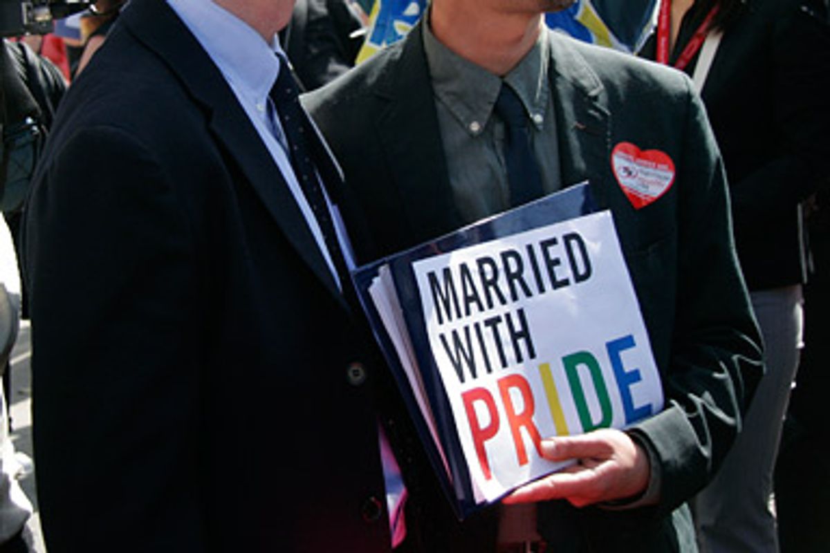A same sex married couple joins the crowd protesting Proposition 8 at the California Supreme Court building in San Francisco on Tuesday, May 26, 2009. 