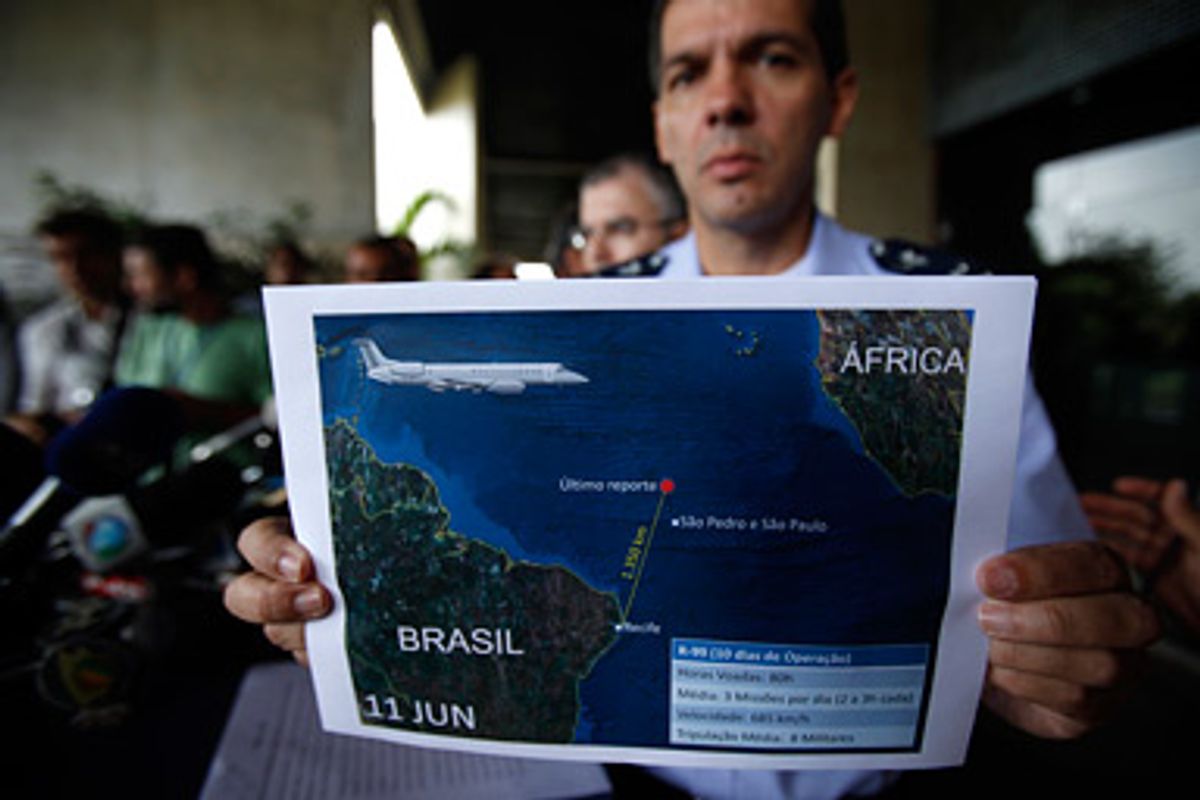 Brazil's Air Force Lt. Col. Henry Munhoz shows an update graphic showing the search zone of the crashed Air France flight 447 in Recife, Brazil, Thursday, June 11, 2009. As storms bore down on the crash zone off Brazil, a French submarine searched the depths of the Atlantic Ocean for the black boxes that hold the best hope of finding out what did happen to the plane when it flew into heavy storms May 31 with 228 people aboard.