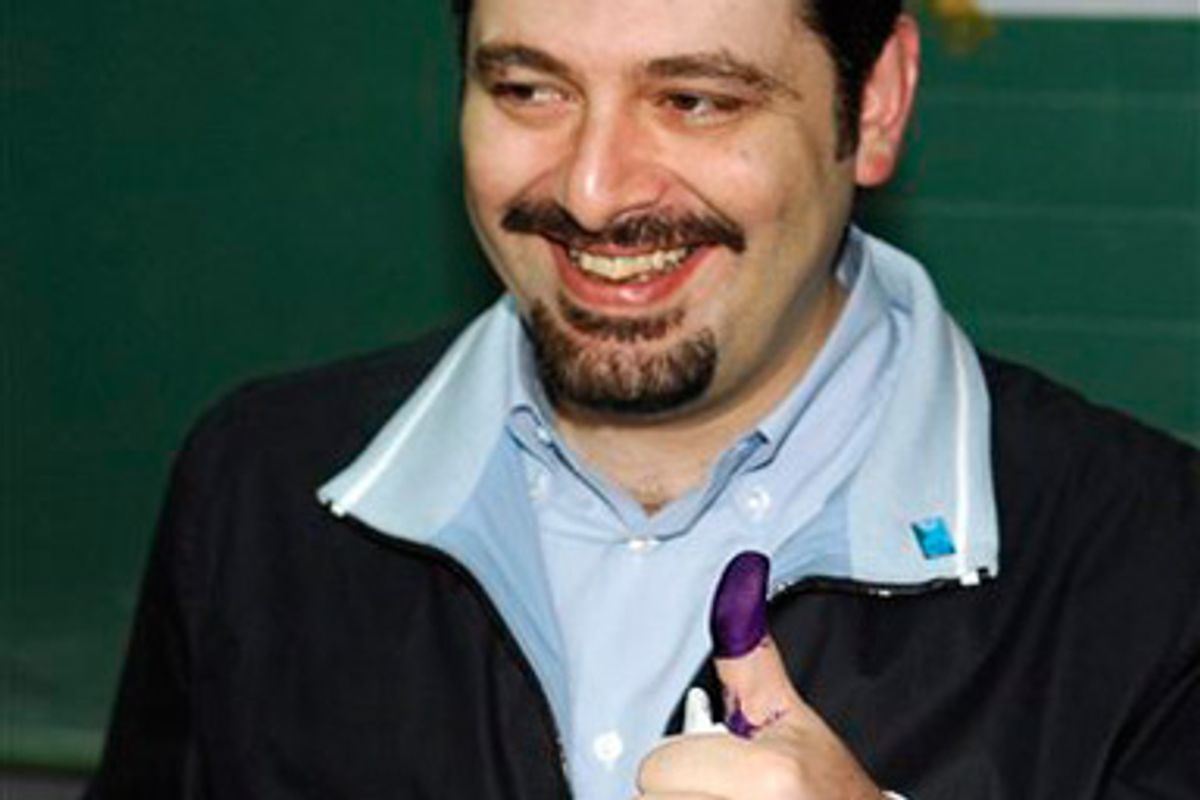 Saad Hariri, one of the top leaders of the pro-Western coalition, shows his ink-stained finger before casting his vote at a polling station in Beirut, Lebanon, Sunday, June 7, 2009. Lebanese streamed to their hometowns on the Mediterranean coast and high up in the mountains Sunday to vote in crucial elections that could unseat a pro-Western government and install one dominated by the Iranian-backed militant group Hezbollah.