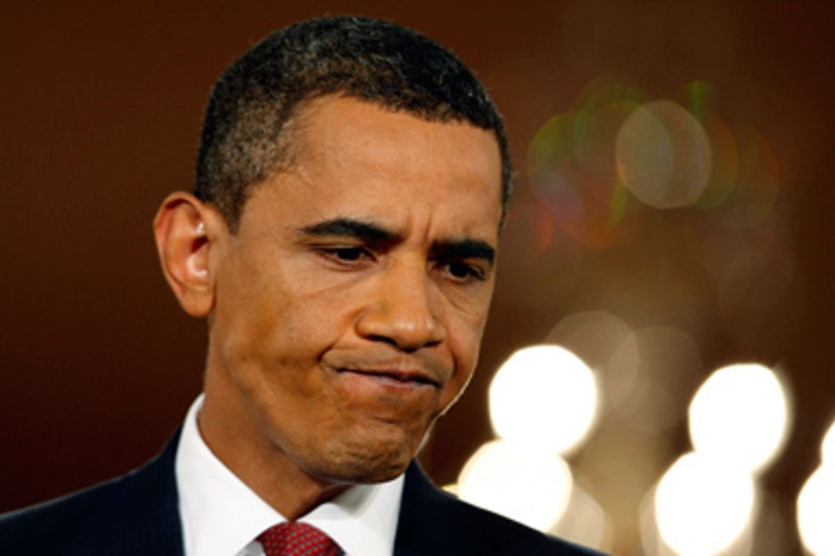 U.S. President Barack Obama listens to a question during a news conference in the East Room of the White House in Washington, July 22, 2009.