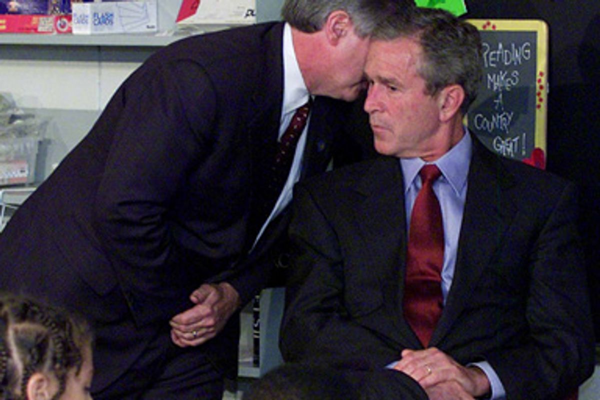 In this Sept. 11, 2001 file photo, President Bush's Chief of Staff Andy Card whispers into the ear of the President to give him word of the plane crashes into the World Trade Center, during a visit to the Emma E. Booker Elementary School in Sarasota, Fla.