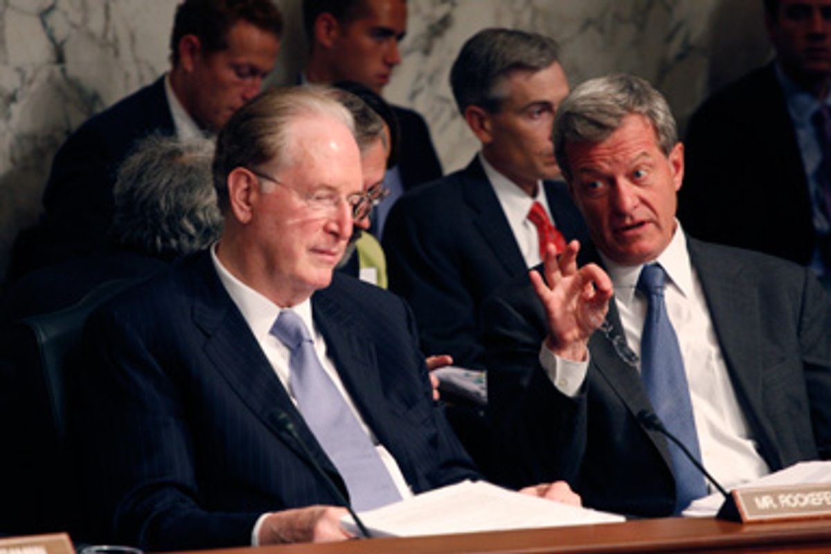 Sen. Jay Rockefeller, D-W.Va., listens as Sen. Max Baucus, D-Mont., makes a point as the Senate Finance Committee continued their markup on health care legislation on Capitol Hill in Washington, Wednesday, Sept. 23, 2009. 