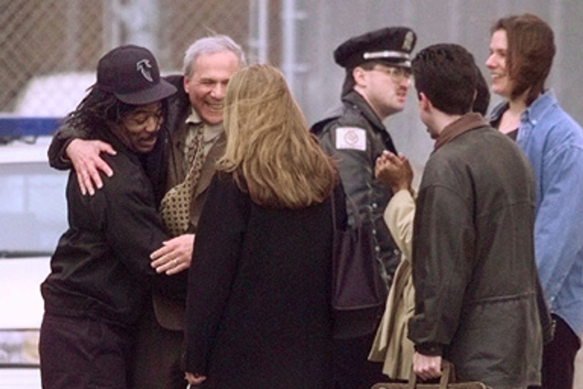 Death Row inmate Anthony Porter hugs Northwestern University journalism Professor David Protess after being released from prison Friday, Feb. 5, 1999, in Chicago.        