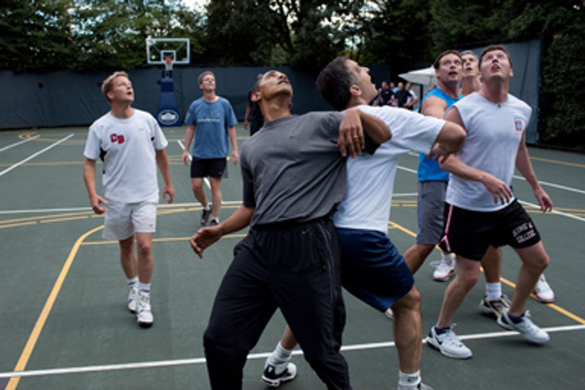 U.S. President Barack Obama, along with Cabinet Secretaries and Members of Congress, watch a shot during a basketball game on the White House court on October 8, 2009 