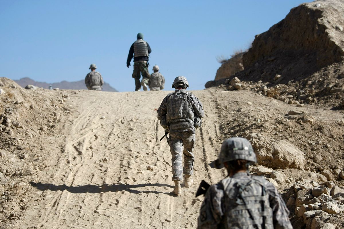 U.S. soldiers walk on a dirt road while on patrol near the town of Pul-i-alam, Logar province, Afghanistan. Afghanistan scored lowest on the Corruption Perceptions Index 2013. (AP Photo/Dario Lopez-Mills)