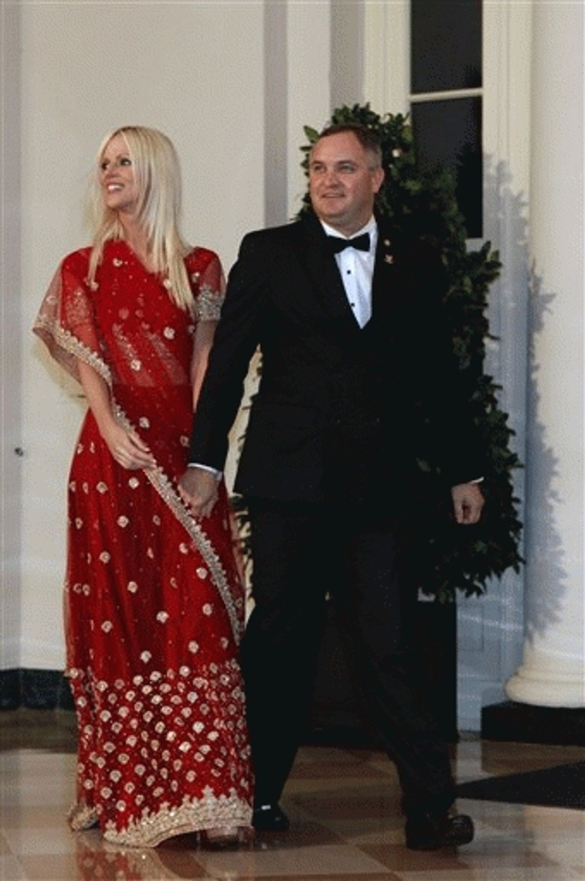 Michaele and Tareq Salahi, right, arrive at a State Dinner hosted by President Barack Obama for Indian Prime Minister Manmohan Singh at the White House in Washington. 
