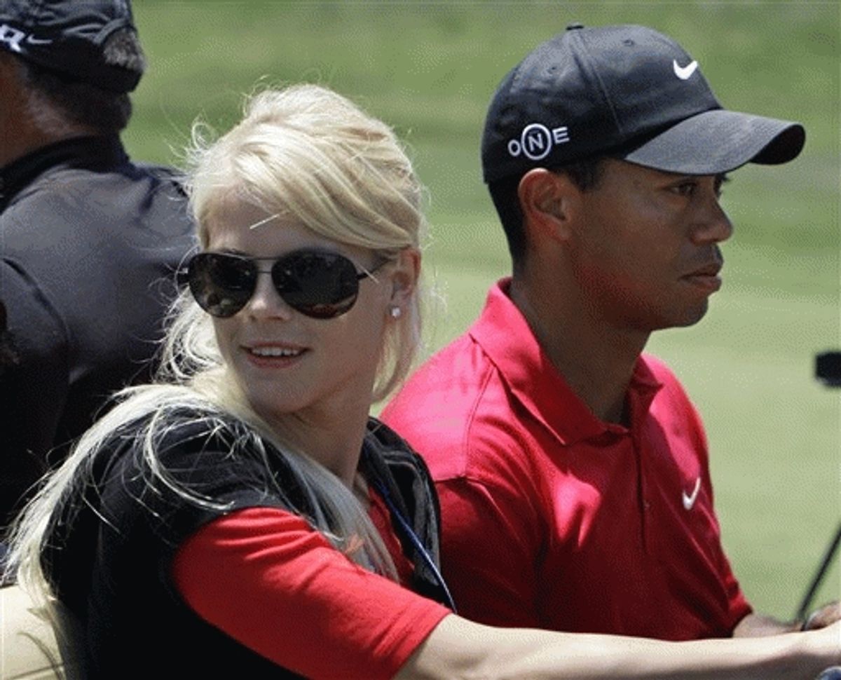 FILE - Tiger Woods' wife, Elin Nordegren, rides next to Woods after winning the US Open championship at Torrey Pines Golf Course on  June 16, 2008.