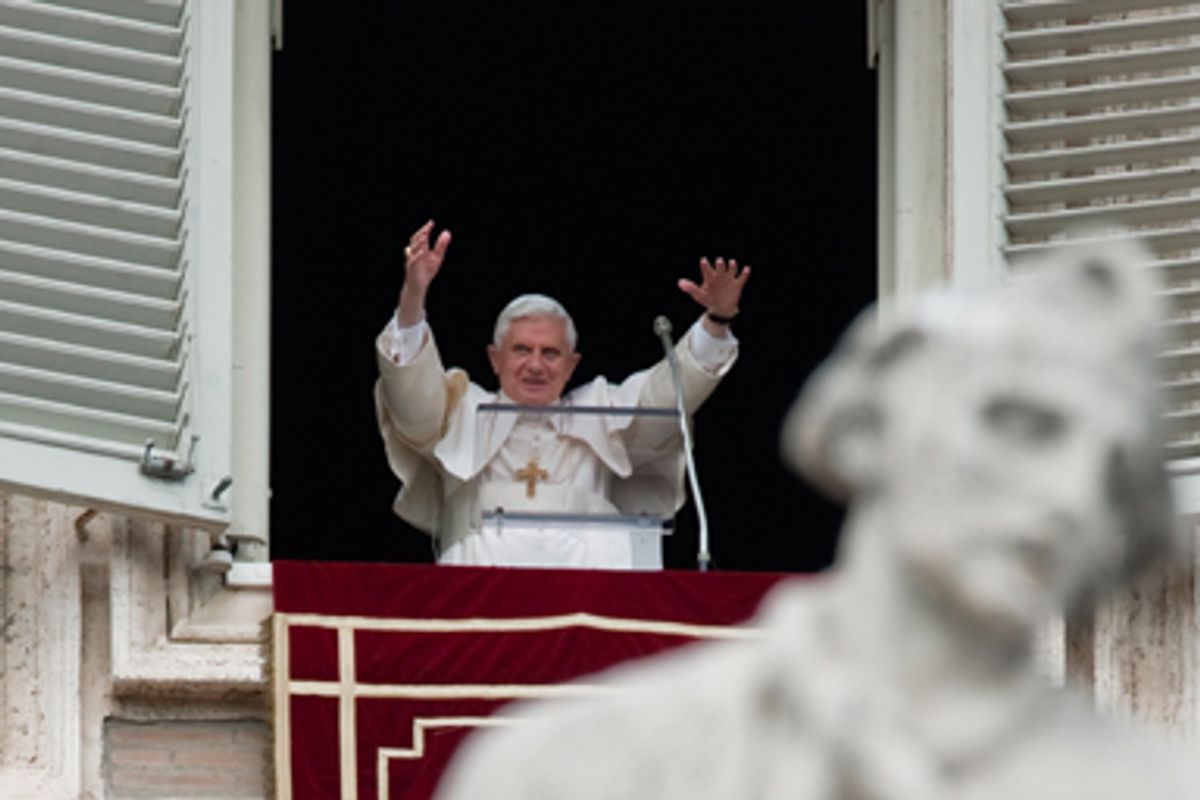 Pope Benedict XVI acknowledges faithful during the Angelus noon prayer celebrated from the window of his studio overlooking St. Peter's Square at the Vatican, Sunday, Oct. 18, 2009.   