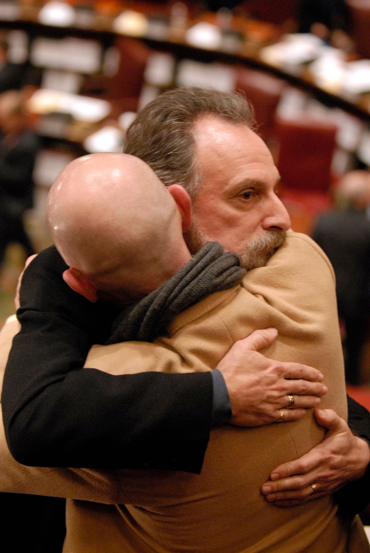 Thomas Sabatino, facing right, of Yonkers, N.Y., consoles Robert Voorheis, his partner of 31 years, after same-sex marriage legislation was defeated in the New York state Senate at the Capitol  N.Y., on Wednesday, Dec. 2, 2009.   Senators voted 38-24 against the bill.  (AP Photo/Tim Roske) (Tim Roske)