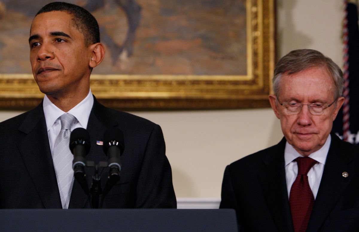 President Barack Obama stands with Senate Majority Leader Harry Reid of Nev., as he makes a statement on health care reform after meeting with Senators, Tuesday, Dec. 15, 2009, at the White House in Washington. (AP Photo/Charles Dharapak) (Associated Press)