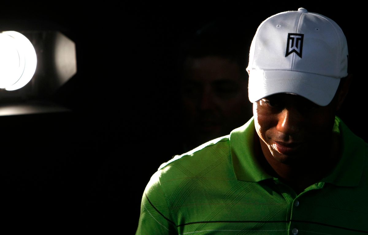 Tiger Woods of the U.S. leaves a news conference ahead of this weeks' Australian Masters golf tournament in Melbourne November 10, 2009. REUTERS/Mick Tsikas   (AUSTRALIA SPORT GOLF) (Reuters)