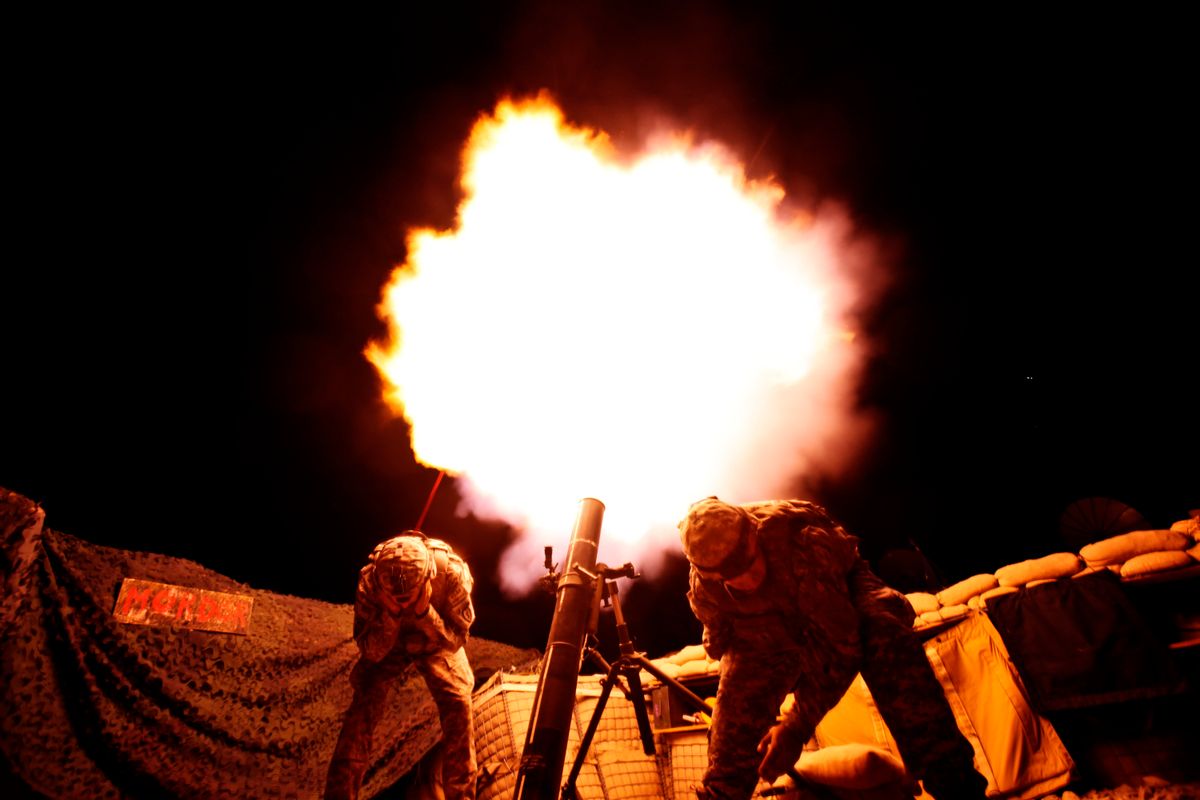 Soldiers from the U.S. Army's 3rd Battalion, 509th Infantry Regiment (Airborne), based at Fort Richardson, Alaska, fire a 120mm mortar during a fire mission at the combat outpost Zerok in East Paktika province in Afghanistan, Wednesday, Sept. 23, 2009. (AP Photo/Dima Gavrysh) (Associated Press)