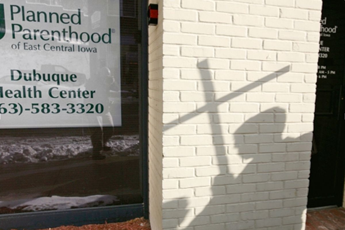 A Right To Life supporter stands near a Planned Parenthood clinic in Dubuque, Iowa, Thursday, January 22, 2009.