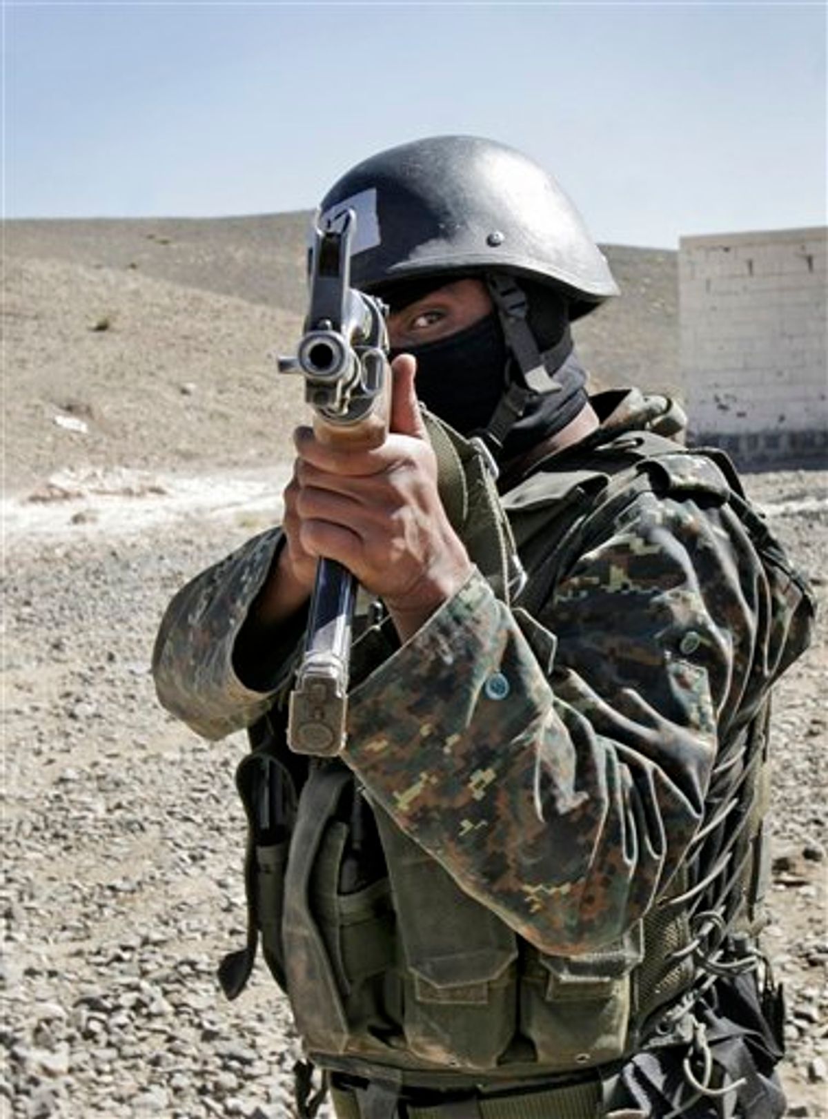 An anti-terrorist unit from the Central Security Forces of the Ministry of Interior trains in the Sarif area on the eastern outskirts of the capital San'a, in Yemen Wednesday, Jan. 6, 2010. Yemeni security forces arrested three suspected al-Qaida militants from a cell that the U.S. has said was linked to a plot against the American or other embassies, the Interior Ministry said Wednesday. (AP Photo) (AP)