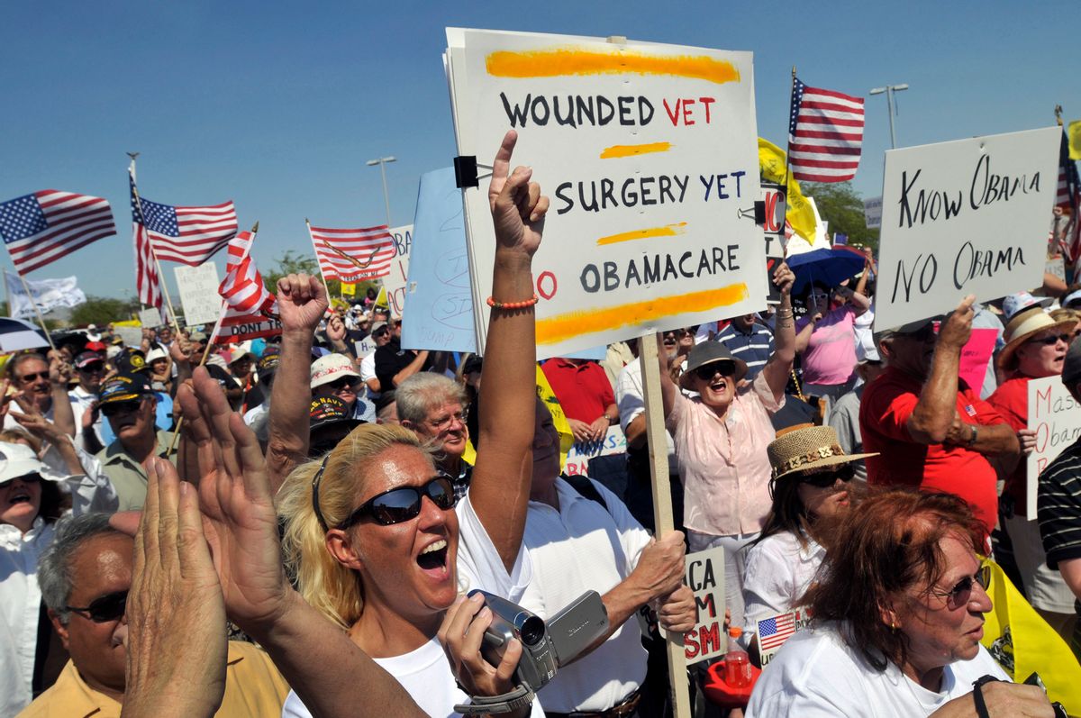 Susan Thomas of Reno, NV., lower left, screams along with several hundred Tea Party protesters at a rally Monday, Aug. 31, 2009,  in Las Vegas.  (AP Photo/David Becker) (David Becker)