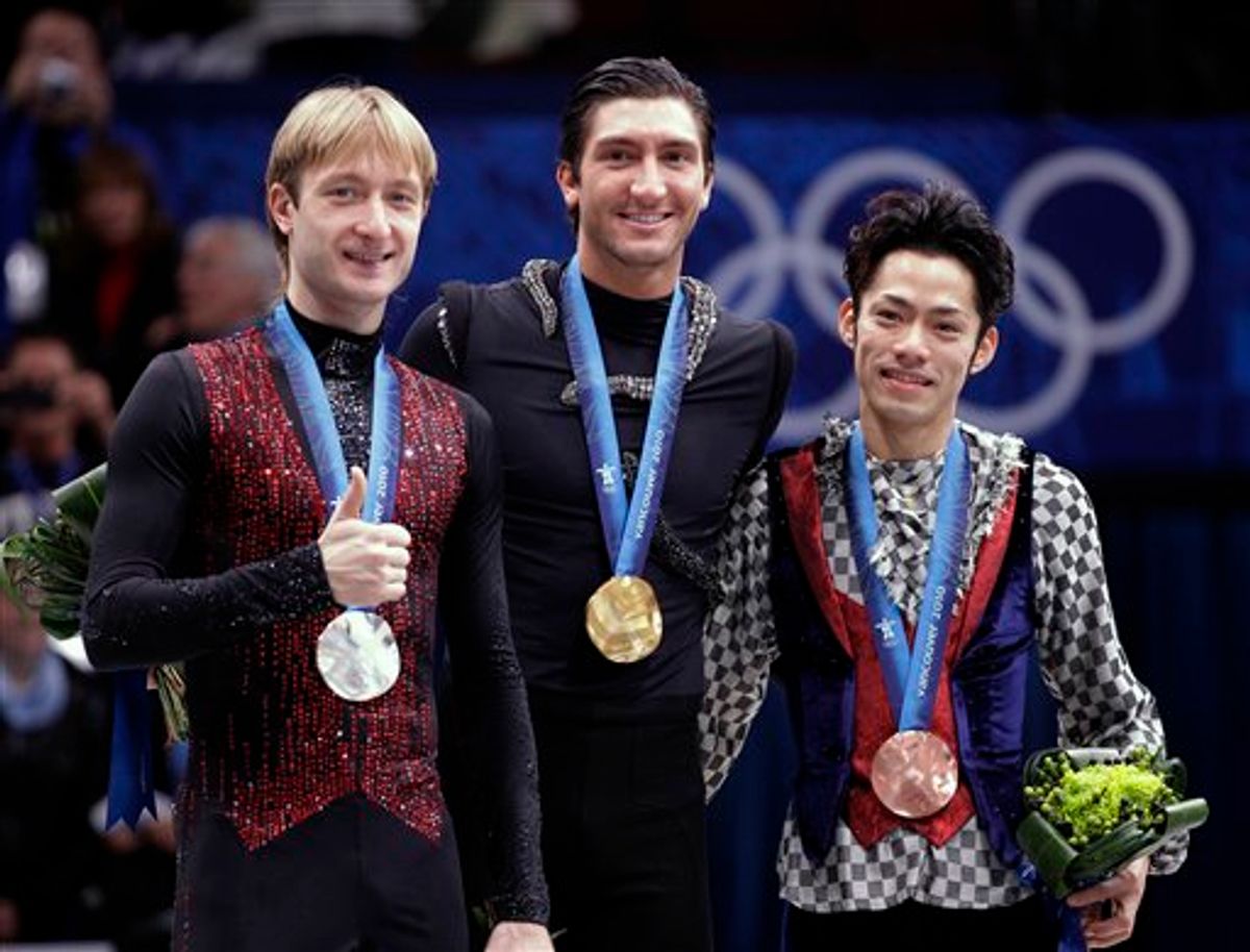 Gold medallist Evan Lysacek of the USA, center, silver medallist Evgeni Plushenko of Russia, left, and bronze medallist Daisuke Takahashi of Japan, right, pose on the podium during the medal ceremony for the men's figure skating competition at the Vancouver 2010 Olympics in Vancouver, British Columbia, Thursday, Feb. 18, 2010. (AP Photo/David J. Phillip) (AP)
