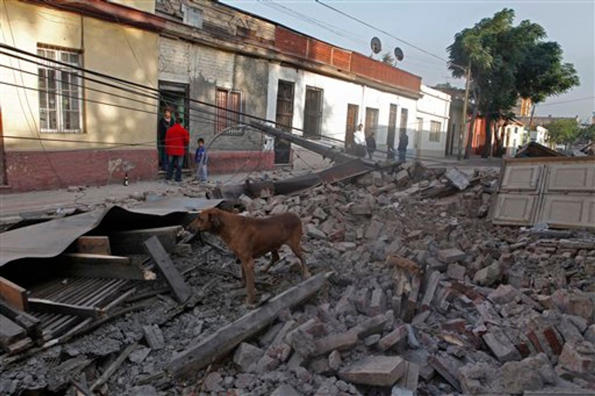 A dog stands in the debris of a collapsed wall on a street in central Santiago, early Saturday, Feb. 27, 2010. A powerful 8.8 magnitude earthquake hit 200 miles (325 kilometers) southwest of the capital  and the epicenter was just 70 miles (115 kilometers) from Concepcion, Chile's second-largest city. ( AP Photo/Aliosha Marquez)  (AP)