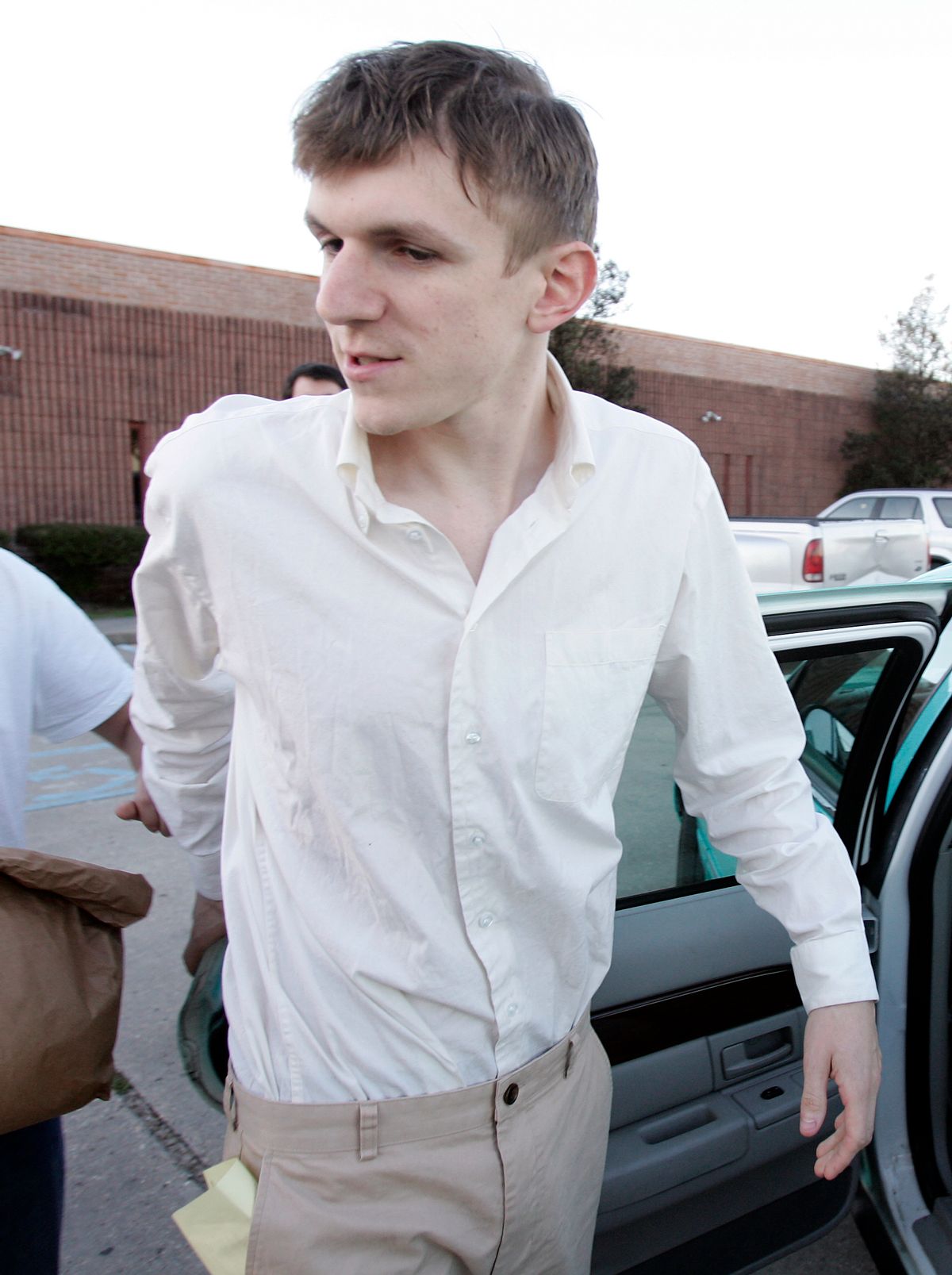 James O'Keefe speaks with the media while getting into a taxi cab after being released from the St. Bernard Parish jail in Chalmette, La., Tuesday, Jan. 26, 2010. O'Keefe, a conservative activist who posed as a pimp to target the community-organizing group ACORN, is one of four people arrested by the FBI and accused of trying to interfere with phones at Sen. Mary Landrieu's office in New Orleans. ()        (AP Photo/Patrick Semansky)