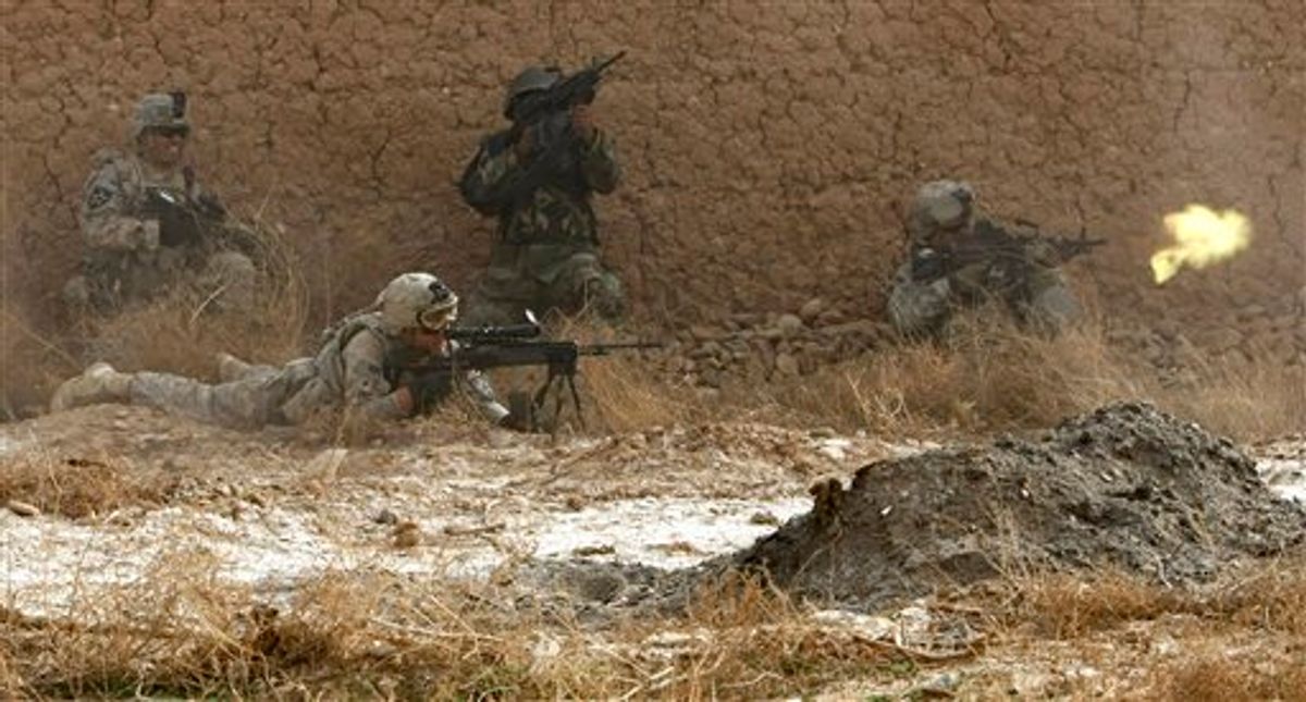 U.S. soldiers and one Afghan soldier exchange fire with insurgents during a patrol in the Badula Qulp area, West of Lashkar Gah  in Helmand province, southern Afghanistan, Sunday, Feb. 14, 2010. In the fight, one soldier was wounded and at least one insurgent was killed. The soldiers are operating in support of a U.S. Marine offensive against the Taliban in Marjah area. (AP Photo/Pier Paolo Cito) (AP)