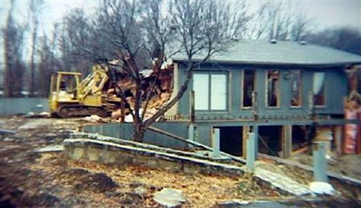 This undated photo released by Terry Hoskins, who allegedly bulldozed his own home after a bank began foreclosure proceedings, shows a bulldozer standing near Hoskins' home in Moscow, Ohio. (AP Photo/Terry Hoskins via WLWT) **NO SALES** (AP)