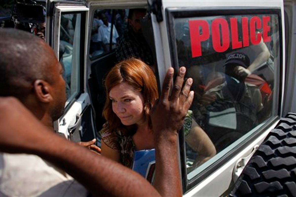 FILE - In this Monday, Feb. 8, 2010 file photo, Laura Silsby, one of the 10 Americans arrested while trying to bus children out of Haiti, exits a police car outside the court building in Port-au-Prince. A closer look at Silsby's life shows that the adoption fiasco follows a predictable pattern surrounding the 40-year-old businesswoman and mother of two: Her big promises and big dreams often give way to questionable actions and frequent legal action. (AP Photo/Javier Galeano, file)  (AP)