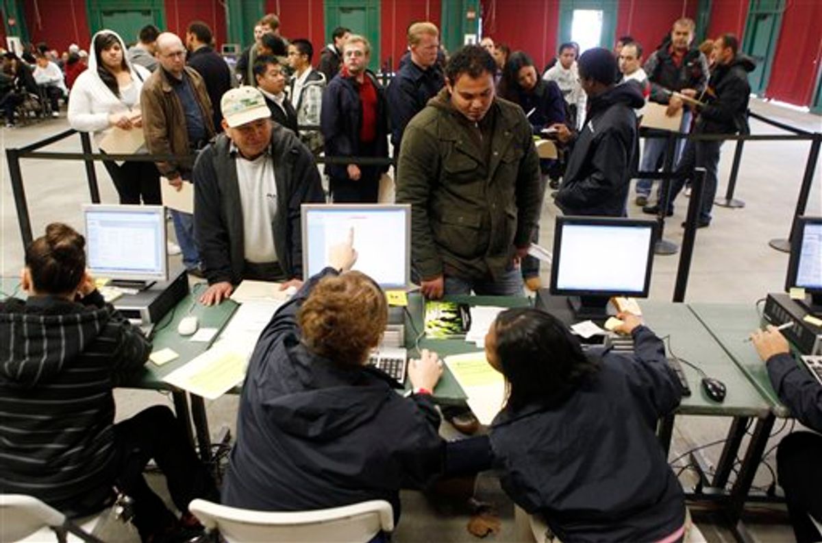 In this Sunday, Jan. 23, 2010 photo, Job applicants, upper, talk with job recruiters at a job fair in Santa Clara, Calif. The number of new claims for unemployment benefits fell less than expected last week, fresh evidence the job market remains a weak spot in the economic recovery.(AP Photo/Paul Sakuma) (AP)