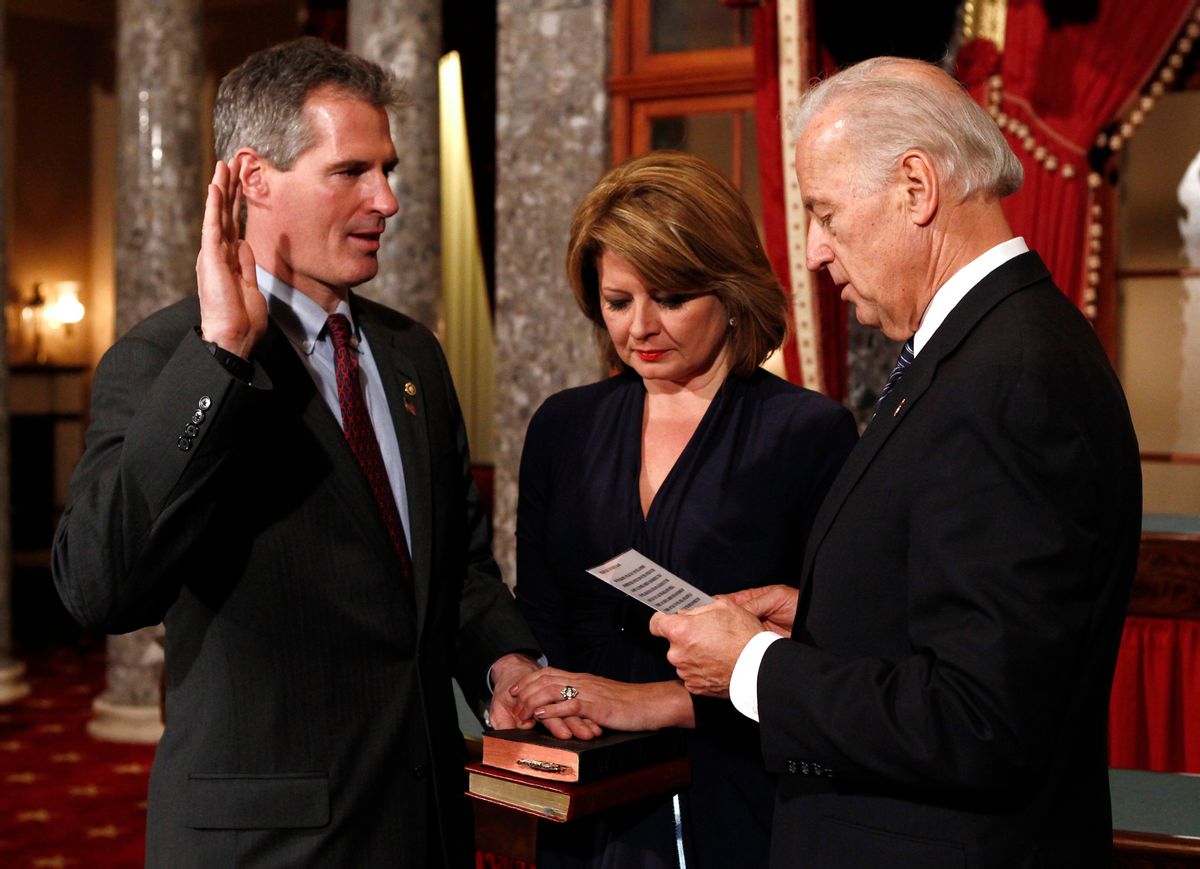 Republican Massachusetts Senator Scott Brown (L) is ceremonially sworn into office by U.S. Vice President Joe Biden (R) in the U.S. Capitol in Washington February 4, 2010. Holding the Bible is Brown's wife Gail Huff.  REUTERS/Kevin Lamarque   (UNITED STATES - Tags: POLITICS) (Reuters)