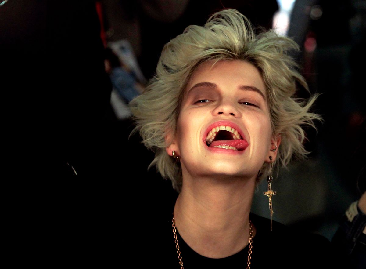Pixie Geldof, daughter of musician Bob Geldof, reacts while having her make-up applied before appearing in the presentation of the Vivienne Westwood 2010 Autumn/Winter collection during London Fashion Week, February 21, 2010. REUTERS/Suzanne Plunkett (BRITAIN - Tags: FASHION ENTERTAINMENT)      (Â© Suzanne Plunkett / Reuters)