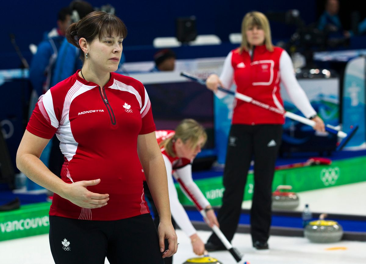 Team Canada alternate Kristie Moore, left, is shown at practice at the Olympic Centre on Monday, Feb. 15, 2010 during the 2010 Vancouver Olympic Winter Games in Vancouver.  Moore is five months pregnant. (AP Photo/The Canadian Press, Nathan Denette) (Associated Press)