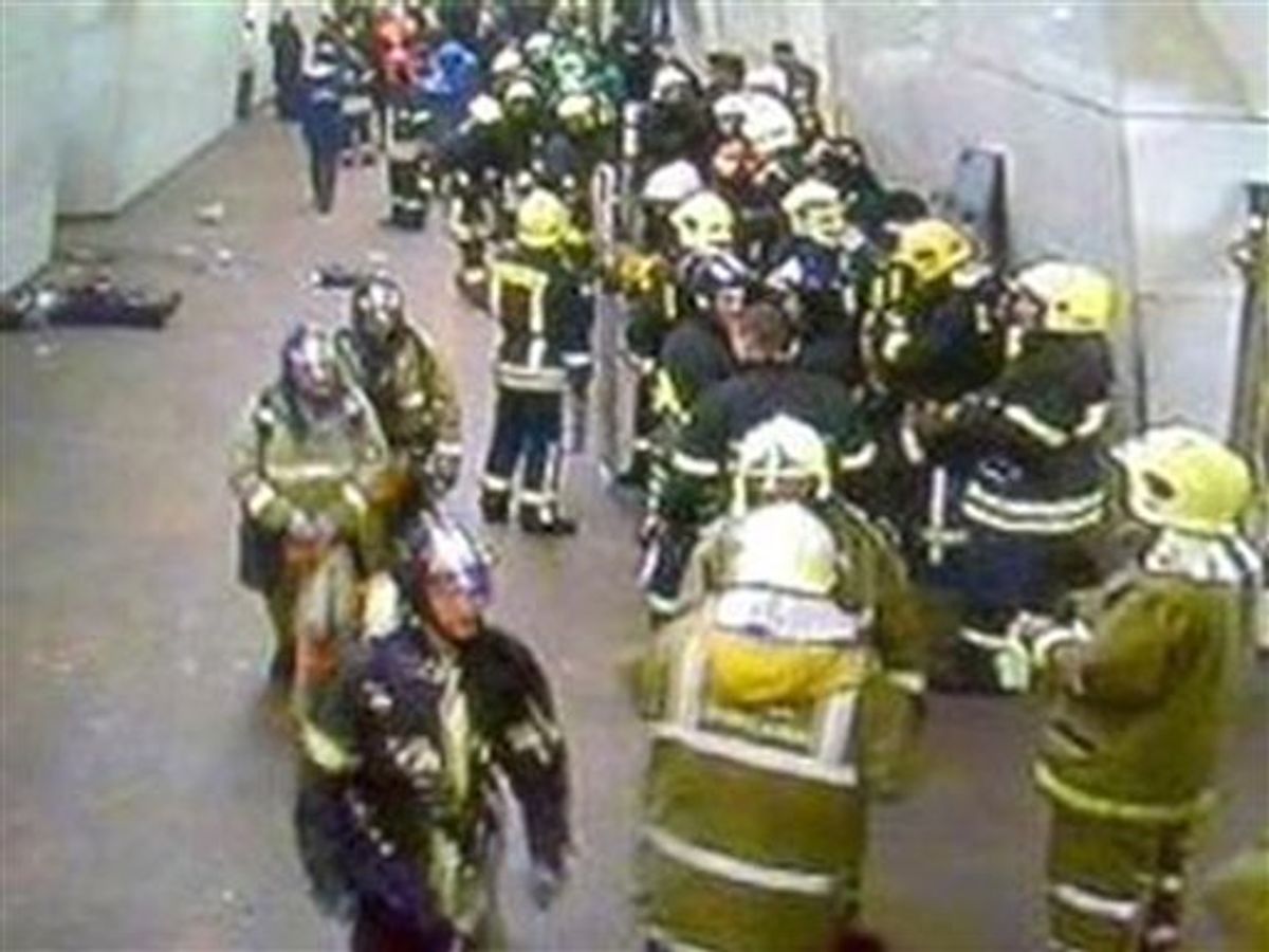 ** CORRECTS LOCATION ** In this image from security cameras emergency workers can be seen as bodies still lie in the passageway of Lubyanka subway station  in central Moscow after a bomb blast Monday March 29 2010. Two female suicide bombers blew themselves up on Moscow's subway system as it was jam-packed with rush-hour passengers Monday, killing at least 35 people and wounding more than 30, the city's mayor and other officials said. Emergency Ministry spokeswoman Svetlana Chumikova said 23 people were killed at the Lubyanka station in central Moscow. (AP Photo) (AP)