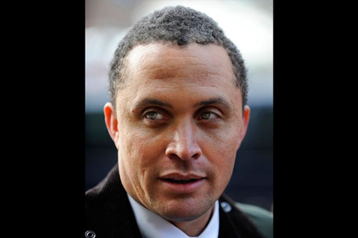 Democrat Harold Ford Jr., listens to a reporter's question before lunching at Sylvia's in the Harlem neighborhood of New York, Jan. 15, 2010. 