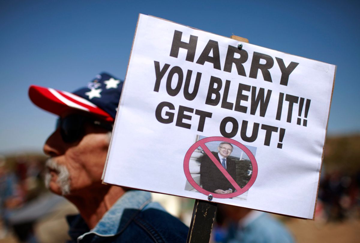 Joe Sanchez, of Las Vegas, holds a sign at the "Showdown in Searchlight" tea party rally in Searchlight, Nev., Saturday, March 27, 2010. (AP Photo/Jae C. Hong)  (Jae C. Hong)