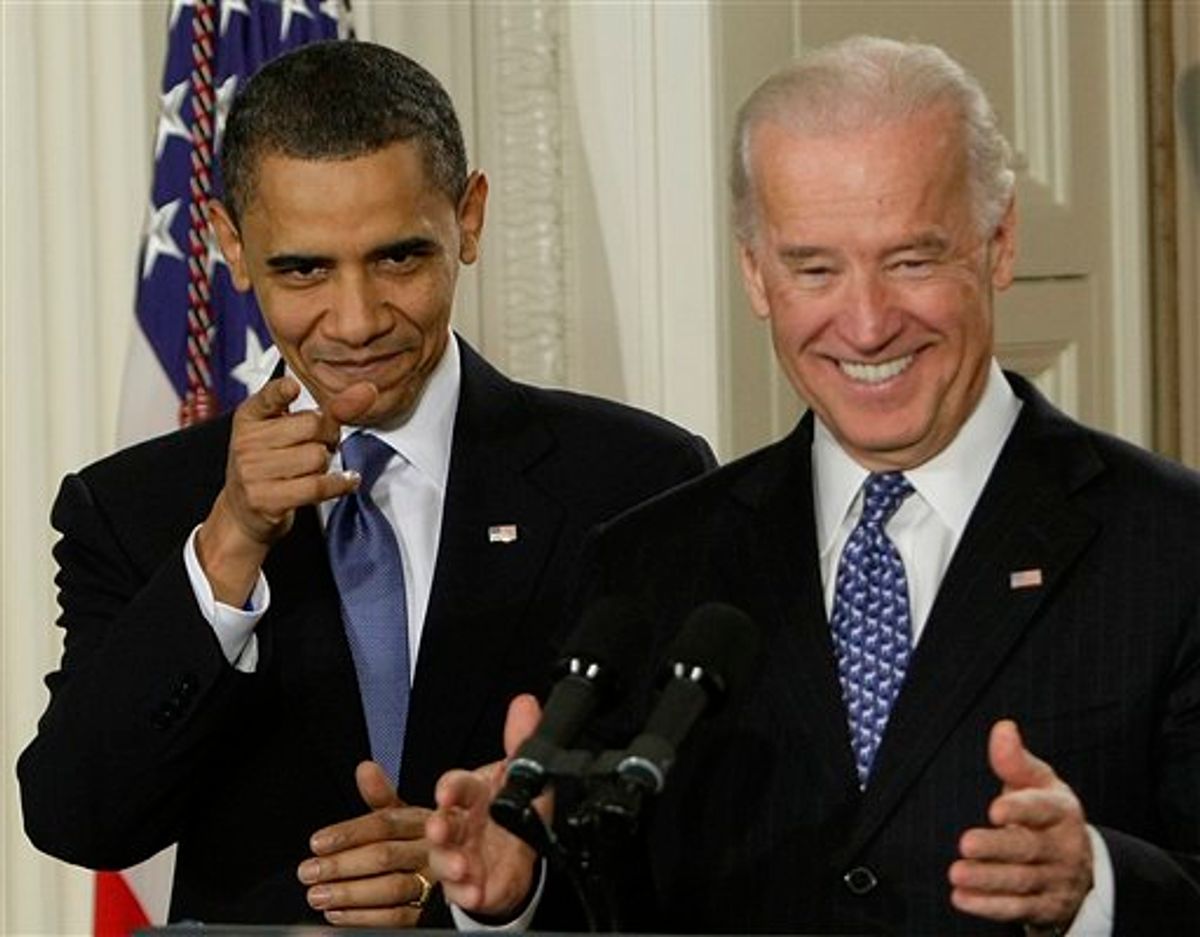 President Barack Obama and Vice President Joe Biden react to cheers as they arrive in the East Room of the White House in Washington,Tuesday, March 23, 2010, for the signing ceremony for the health care bill. (AP Photo/J. Scott Applewhite) (AP)