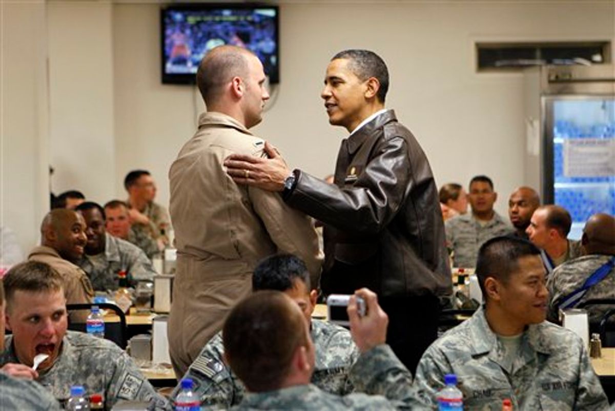 President Barack Obama greets military personnel in Dragon dining facility at Bagram Air Base in Afghanistan, Monday, March 29, 2010. (AP Photo/Charles Dharapak) (AP)