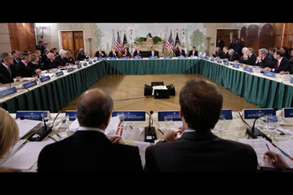 President Barack Obama, center, accompanied by Vice President Joe Biden, and others, is seen during their meeting for healthcare reform, as they met with Republican and Democratic leaders, Thursday, Feb. 25, 2010.