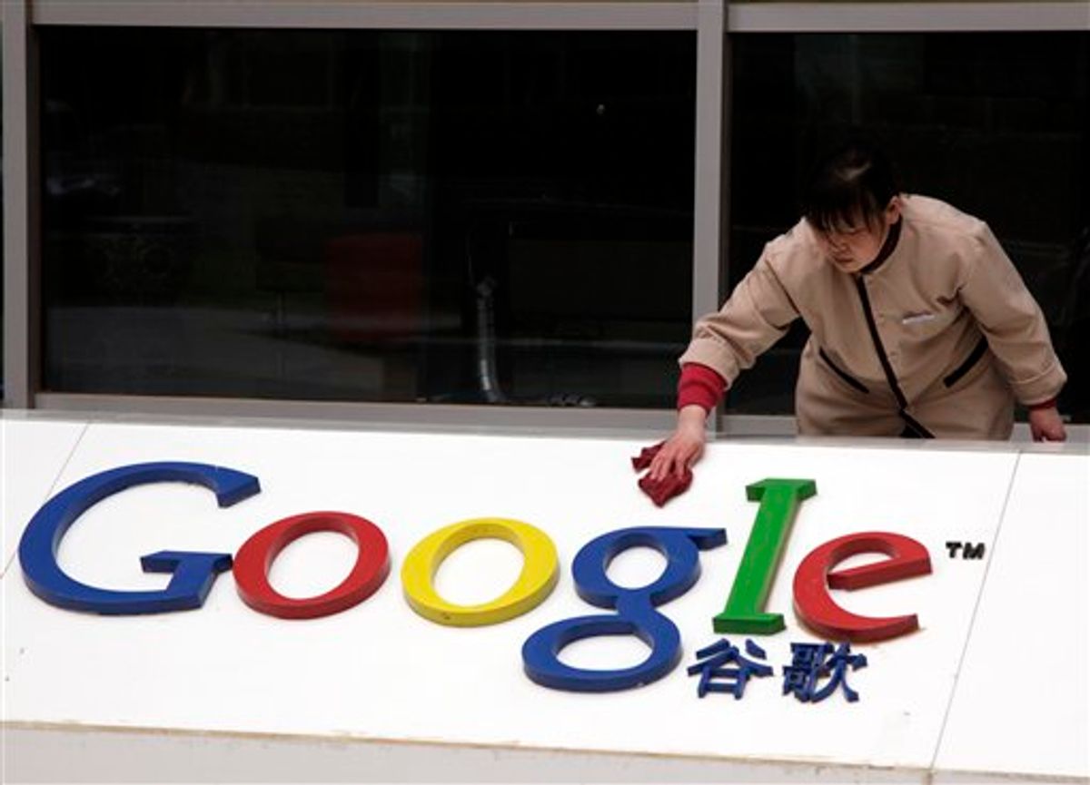 A worker cleans the sign in front of Google China headquarters in Beijing, Monday, March 22, 2010. Google Inc. will shift its search engine for China off the mainland and maintain other operations in the country. It's an attempt to balance its stance against censorship with its desire to profit from an explosively growing Internet market.  (AP Photo/Ng Han Guan) (AP)