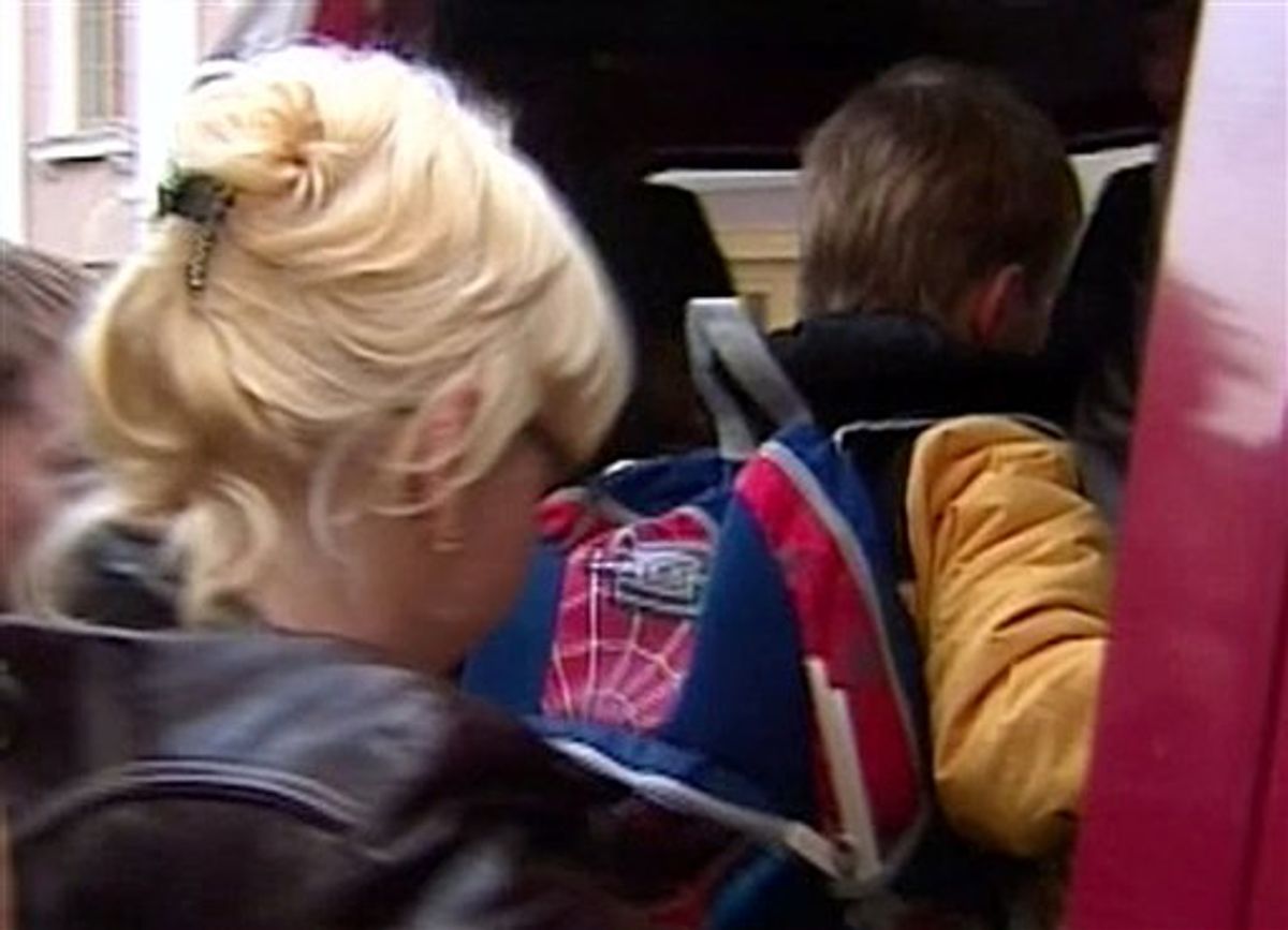 ** CORRECTS BOYS AGE IN LIGHT OF SUBSEQUENT INFORMATION ** In this image taken from Rossia 1 television channel TV, 7-year-old adopted Russian boy Artyom Savelyev gets into a minivan outside a police department office  in Moscow, Thursday, April 8, 2010. Russia should freeze all child adoptions with U.S. families, the country's foreign minister urged Friday after an American woman allegedly put her 8-year-old adopted Russian son on a one-way flight back to his homeland. Artyom Savelyev arrived in Moscow unaccompanied Thursday on a United Airlines flight from Washington, the Kremlin children's rights office said Friday April 9.(AP Photo/Rossia 1 Television Channel)** TV OUT ** (AP)