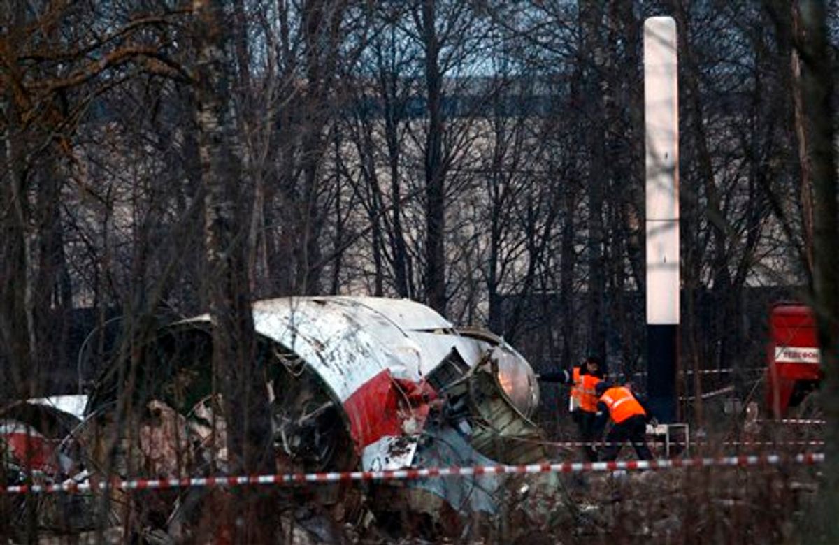 Rescue workers inspect the debris on the site of the plane crash near Smolensk, western Russia, Sunday, April 11, 2010. Polish President Lech Kaczynski, his wife and some of the country's most prominent military and civilian leaders died Saturday along with dozens of others when the presidential plane crashed as it came in for a landing in thick fog. (AP Photo/Sergey Ponomarev)  (AP)