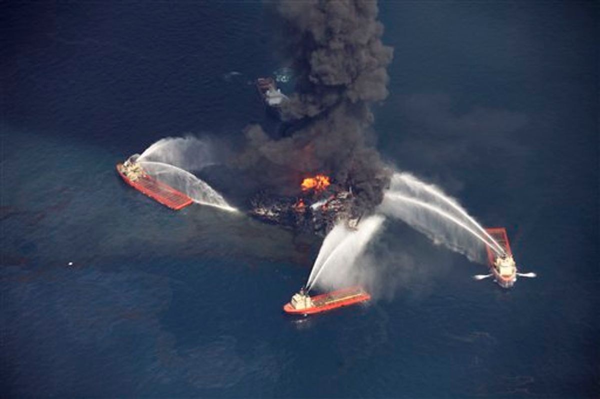 FILE - In this aerial file photo taken Wednesday, April 21, 2010 in the Gulf of Mexico, more than 50 miles southeast of Venice on Louisiana's tip, an oil slick is seen as the Deepwater Horizon oil rig burns. The oil rig, which erupted in flames March 20, 2010, and is at the center of a massive spill off the Louisiana coast, has a history of minor incidents attributed to equipment failure, human error and bad weather during its nine-year operating history, according to official records.(AP Photo/Gerald Herbert, file)   (AP)