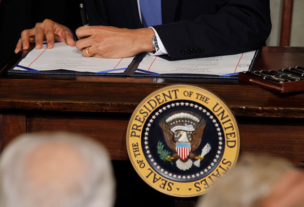 U.S. President Barack Obama signs the healthcare legislation during a ceremony in the East Room of the White House in Washington, March 23, 2010.   REUTERS/Jason Reed   (UNITED STATES - Tags: POLITICS HEALTH)   (Reuters)