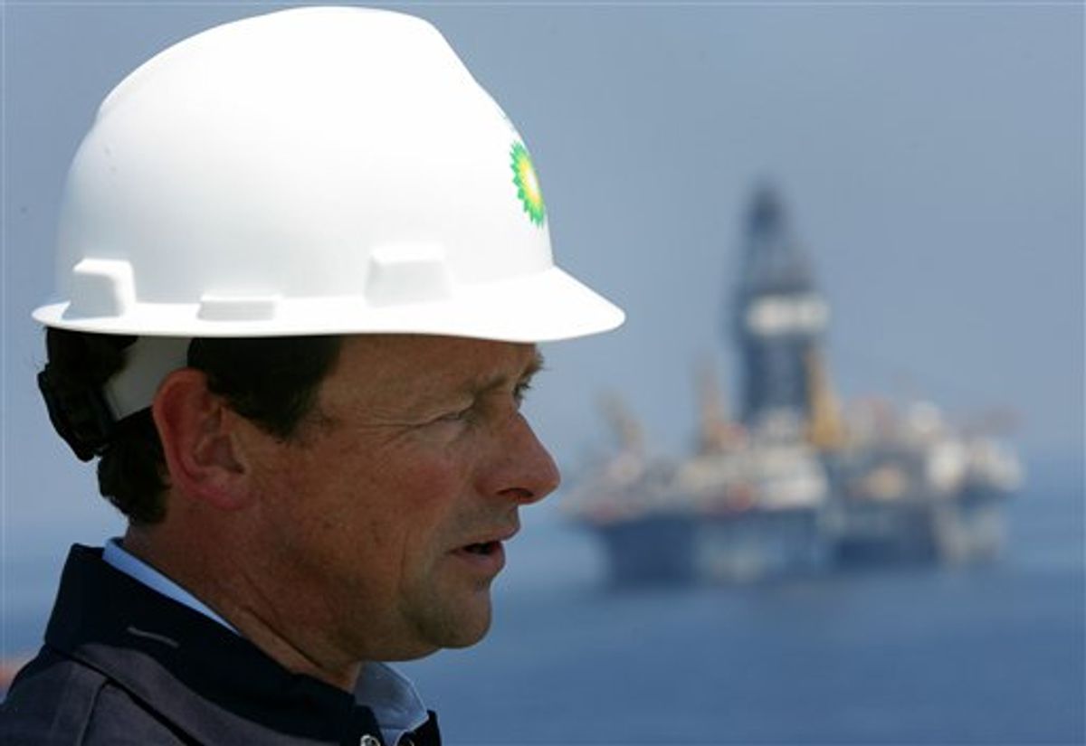 In this May 28, 2010 photo, BP Wellsite leader George Walker, left, meets with BP CEO Tony Hayward aboard the Discover Enterprise drill ship during recovery operations in the Gulf of Mexico, south of Venice, La. (AP Photo/Sean Gardner, Pool) (AP)