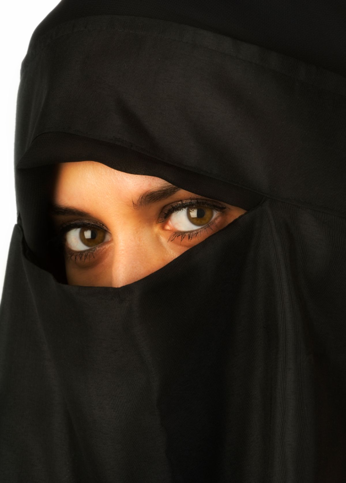 Beautiful Middle eastern woman in niqab traditional veil isolated against a white background