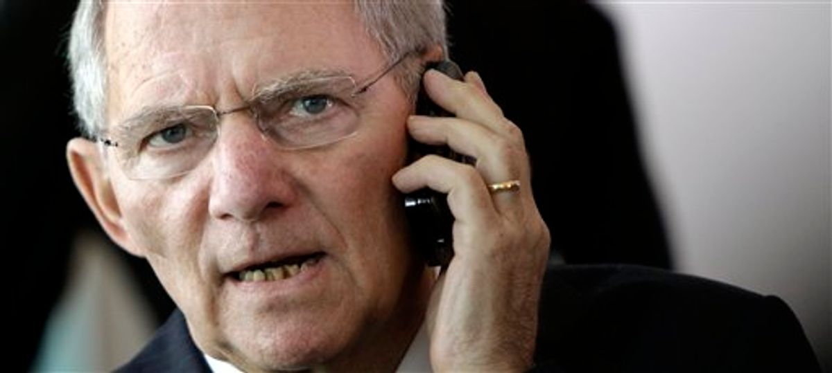 German Finance Minister Wolfgang Schaeuble makes a telephone call prior to a meeting of the cabinet at the chancellery in Berlin, Germany, Wednesday, May 19, 2010. German Chancellor Angela Merkel called Wednesday for tougher financial regulation and a crackdown on government debt, saying the future of the euro currency and a united Europe itself were at stake. Merkel urged lawmakers to pass Germany's share of a new 750 billion euro  (US dlrs 1 trillion) eurozone rescue package, saying that defending the shared European currency is "about no more and no less than the preservation of the European idea."  (AP Photo/Michael Sohn) (AP)
