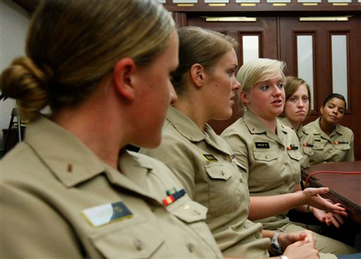 Midshipman Jessica Wilcox, center, responds to a reporter's question at the U.S. Naval Academy in Annapolis, Md., Thursday, May 6, 2010. Wilcox is one of 11 women selected to begin training to become submarine officers this summer in a program that takes at least 15 months. They will report for duty aboard a submarine by 2012.  (AP Photo/Ann Heisenfelt) (AP)