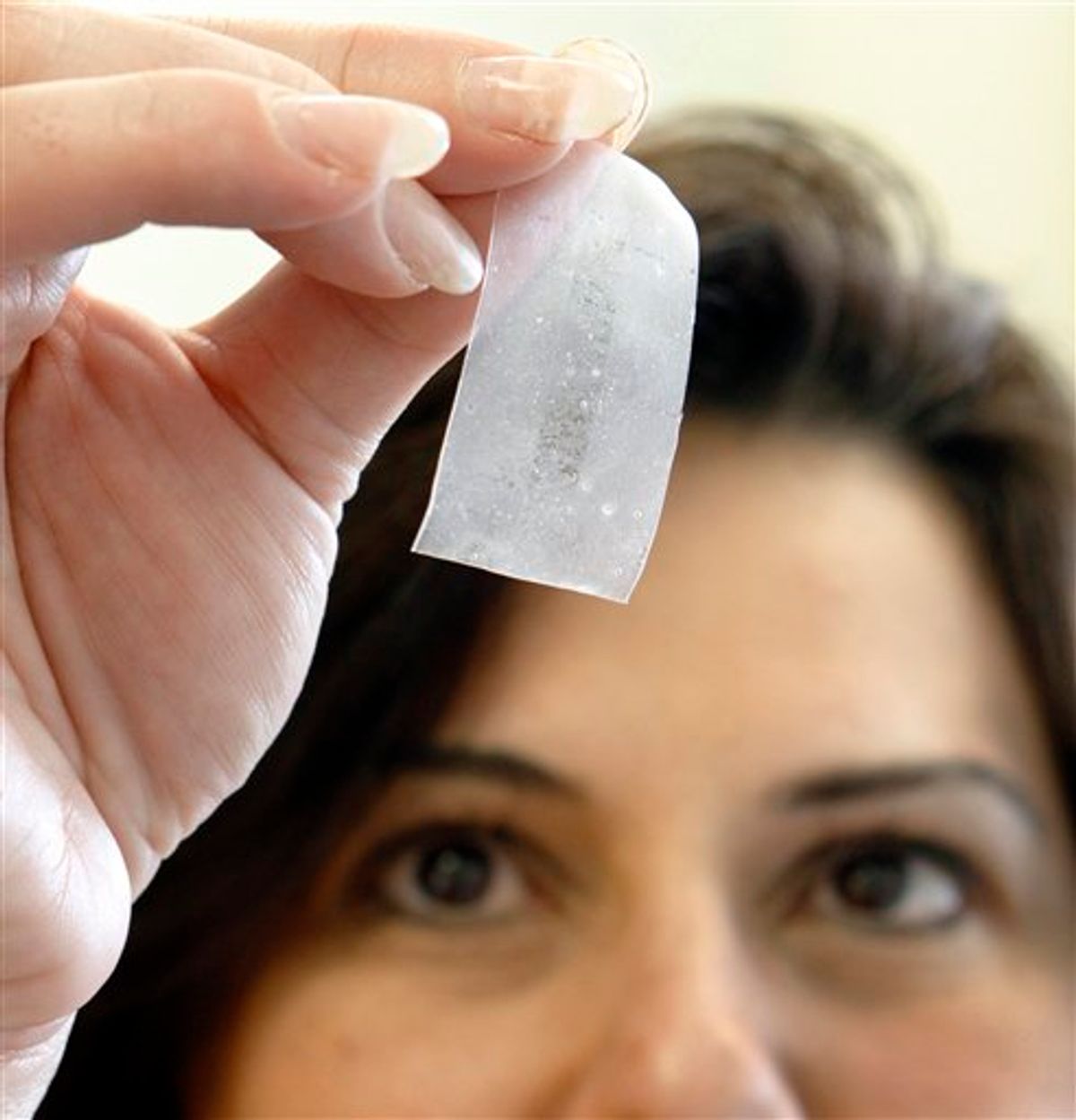 In this photo taken Friday, May 14, 2010, at the MaGee Womens Research Institute in  Pittsburgh, lead researcher Lisa Rohan shows a vaginal film formulated with drugs to target against HIV infection.  (AP Photo/Keith Srakocic) (AP)